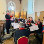 A conductor leading a band